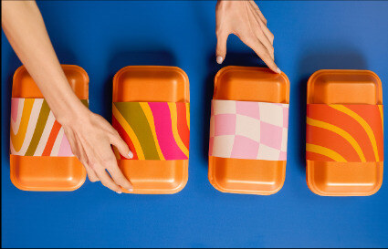 Packaging trays arranged on a blue background