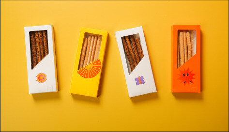 Retail packaging arranged on a yellow background